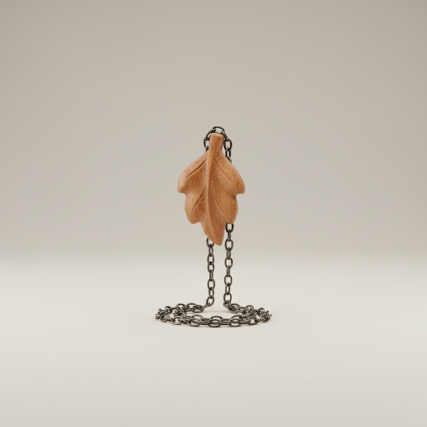 Professional e-commerce product photography of a **brandless** Forest Whisper Pendant (A handcrafted pendant featuring a hand carved wooden leaf suspended from a rustic chain.). The entire environment is a perfectly uniform, flat, solid color #EAE9E7 (light warm gray) with absolutely no gradient, vignette, spotlighting, texture, noise, or grain. The object is centered and tiny, occupying only 25% of the frame, surrounded by massive negative space. The background and floor are a seamless, infinite cyclorama of solid color #EAE9E7 with no horizon line, no corner, and no visible wall/floor transition. Lighting: ultra-even high-key with very strong global illumination and soft, multi-directional bounced fill (studio light tent look). Bright exposure (lifted midtones and shadows, low contrast), slightly overexposed overall while preserving product detail. Fully diffuse, no hard shadows, no cast shadows; at most a barely visible neutral contact shadow. No harsh specular highlights. Framing: simple 3/4 view. Perfectly centered. Style: ultra-clean, minimalistic. No logos, no text, no distractions. 8k resolution, sharp details on the object.